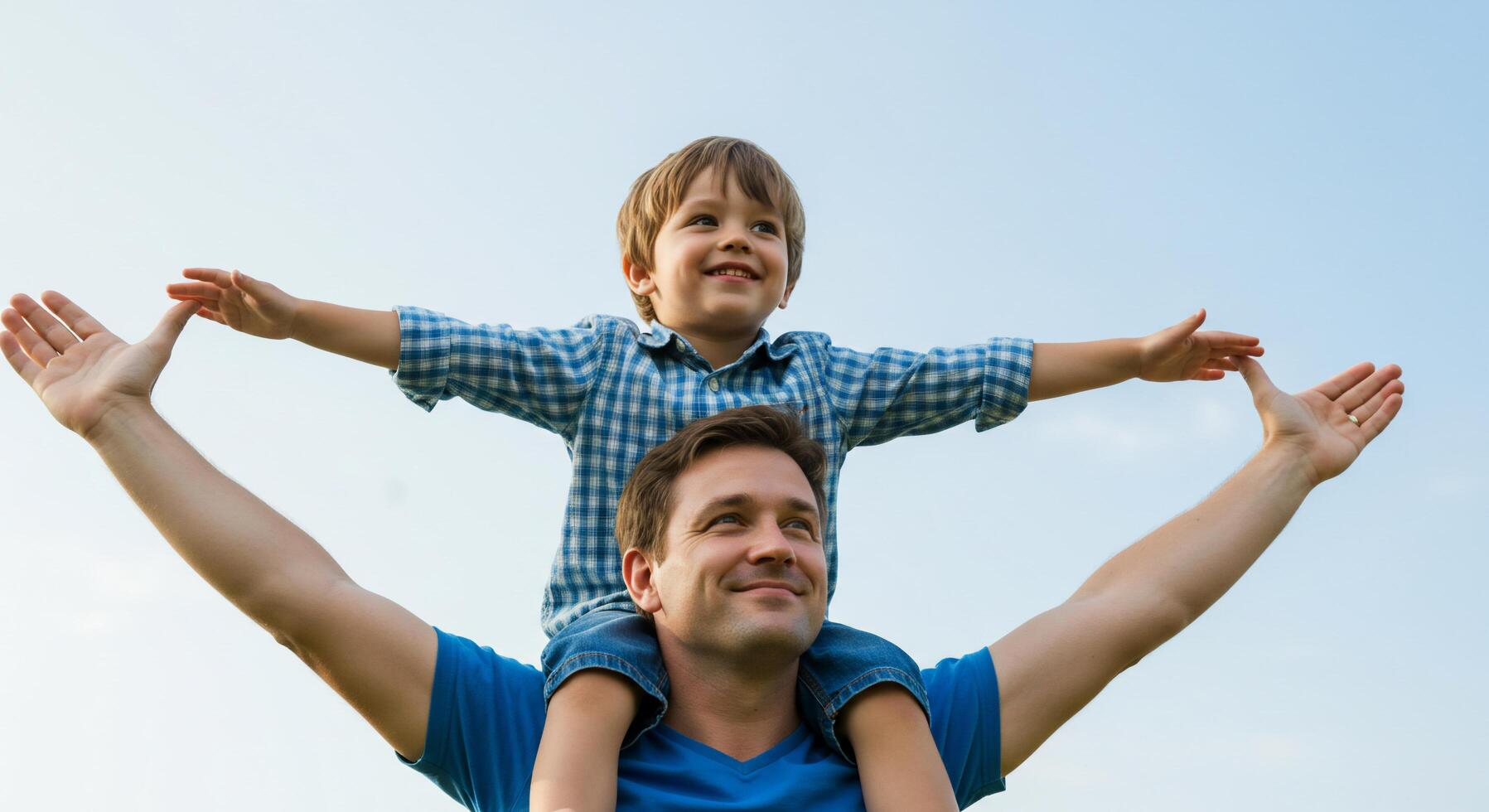 A man and a child are holding up their arms photo