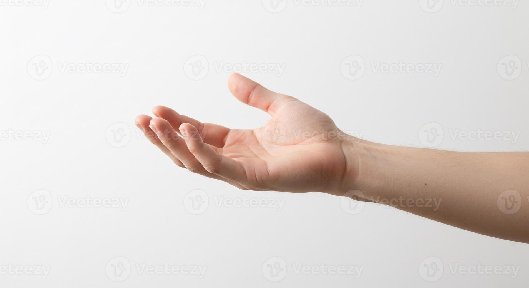 A person's hand reaching out to grab something photo