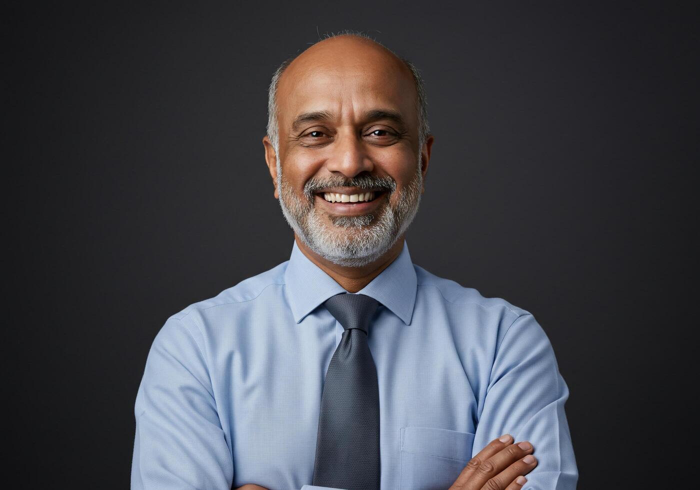 A man with a beard and tie smiling photo