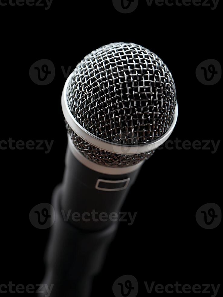 A black microphone on black background. photo