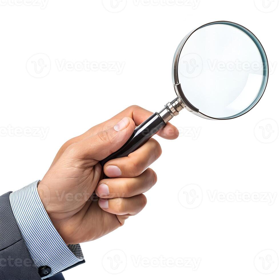 A man holding a magnifying glass over his hand photo