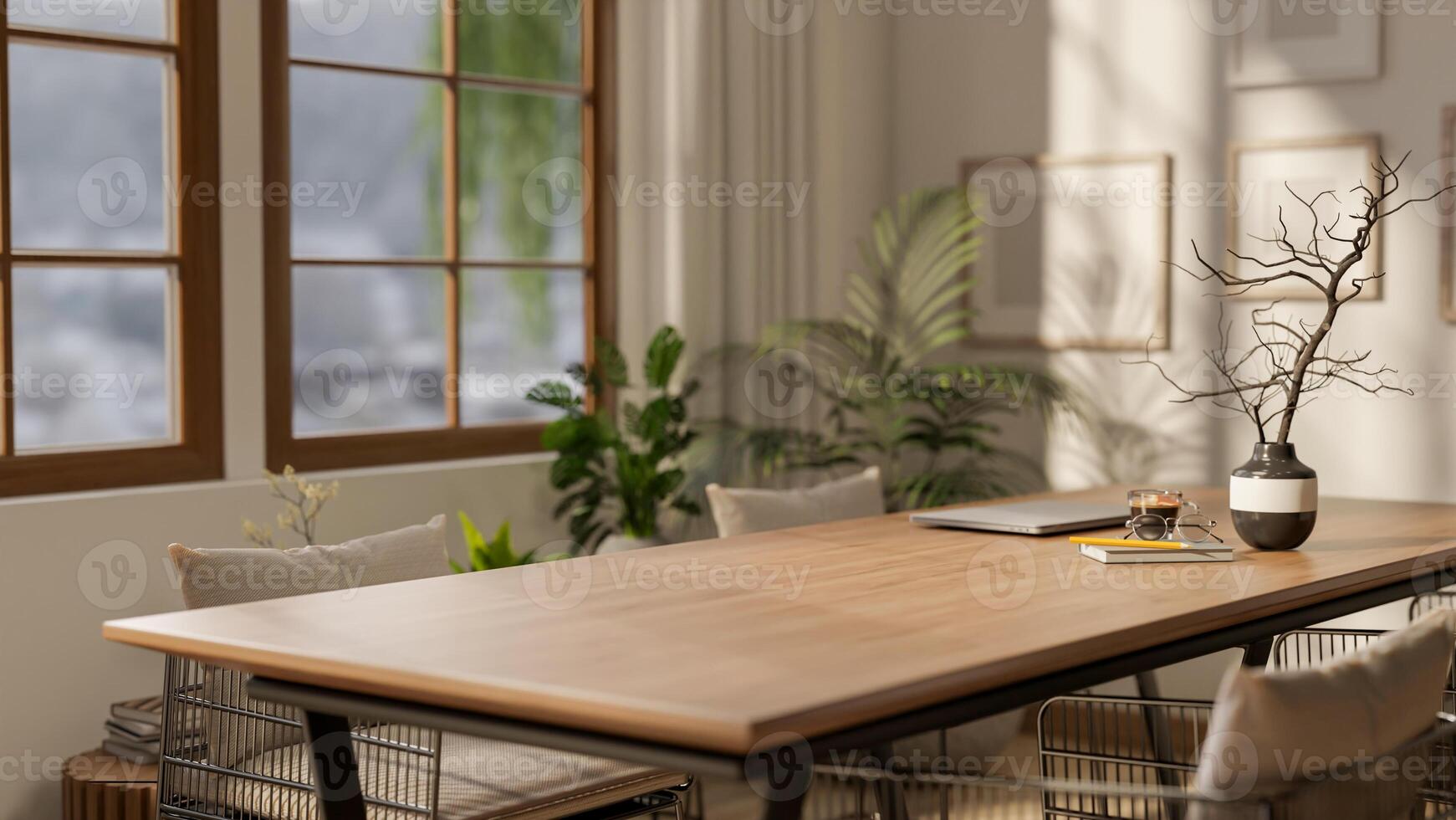 A wooden square table with decors and armchairs next to a large window with bright sunlight. photo