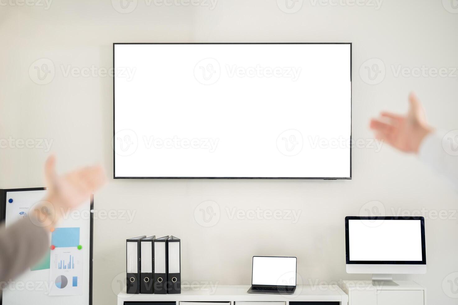 A large white screen monitor on the meeting room wall. Mock up for product display or advertisement. photo