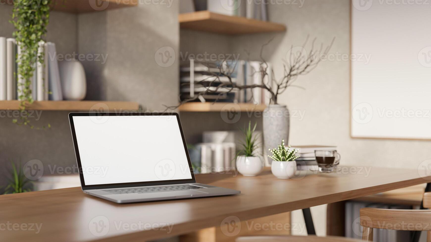 The white screen laptop and a coffee cup on a long wooden table with decors in the bright room. photo