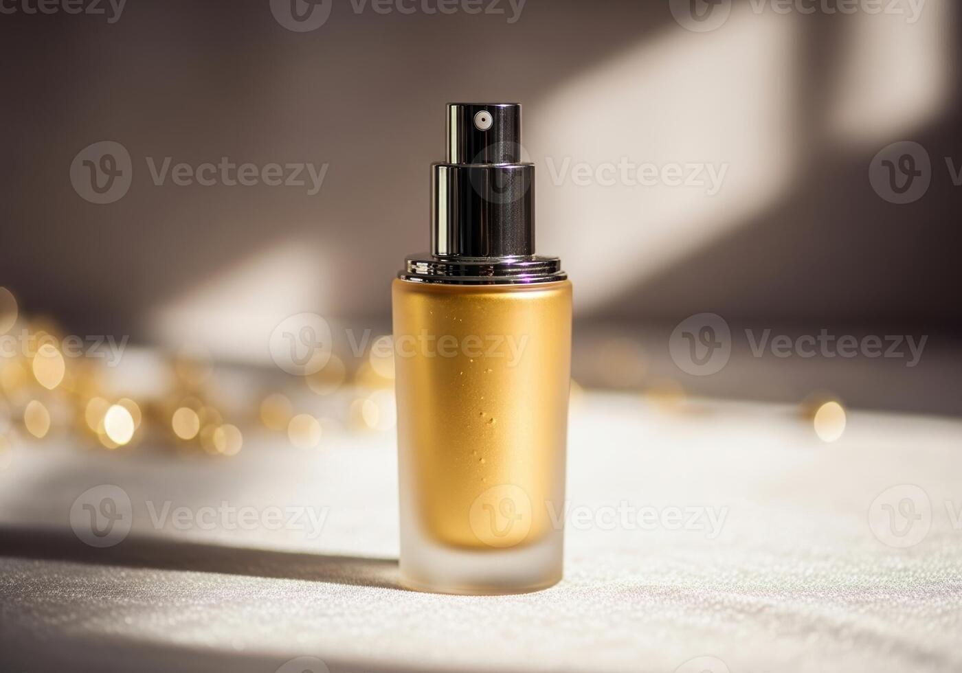 A golden liquid bottle of makeup sitting on a table photo