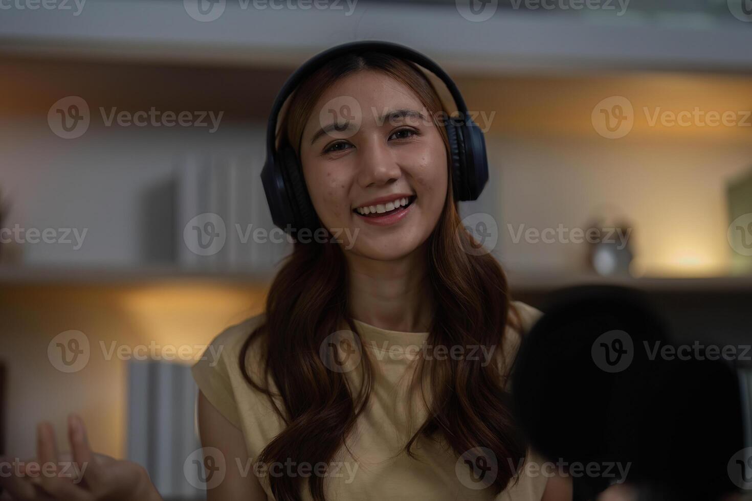 Smiling Content Creator in Home Studio During Live Stream photo