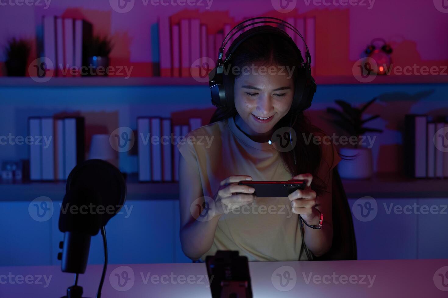 Focused Gamer Playing Mobile Game with Enthusiasm photo
