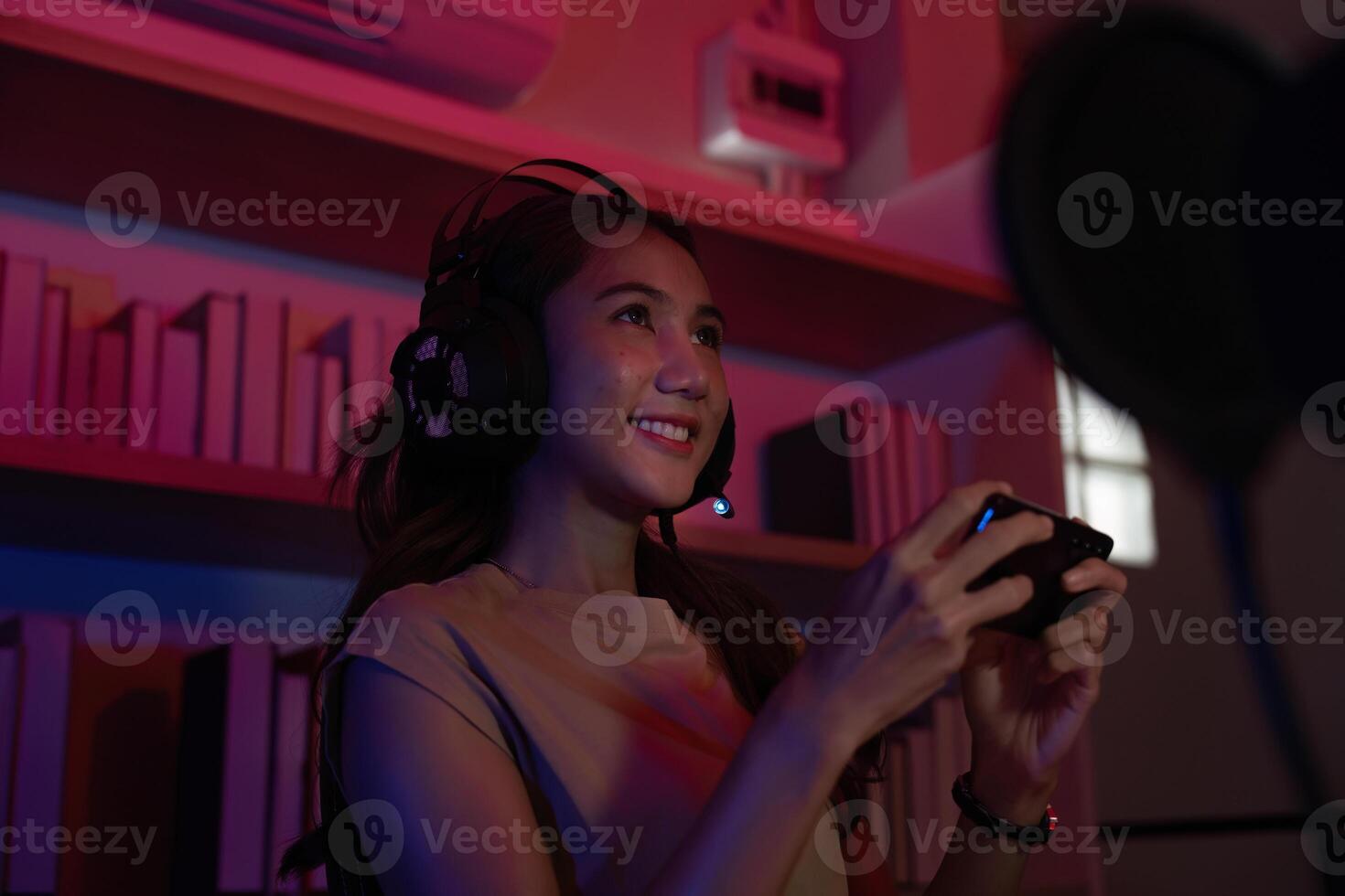 Excited Gamer Engaging in Competitive Play with Headset photo