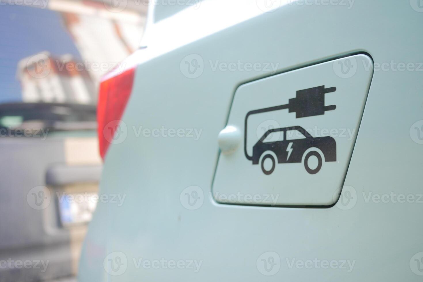 Charging electric vehicle at a modern charging station photo