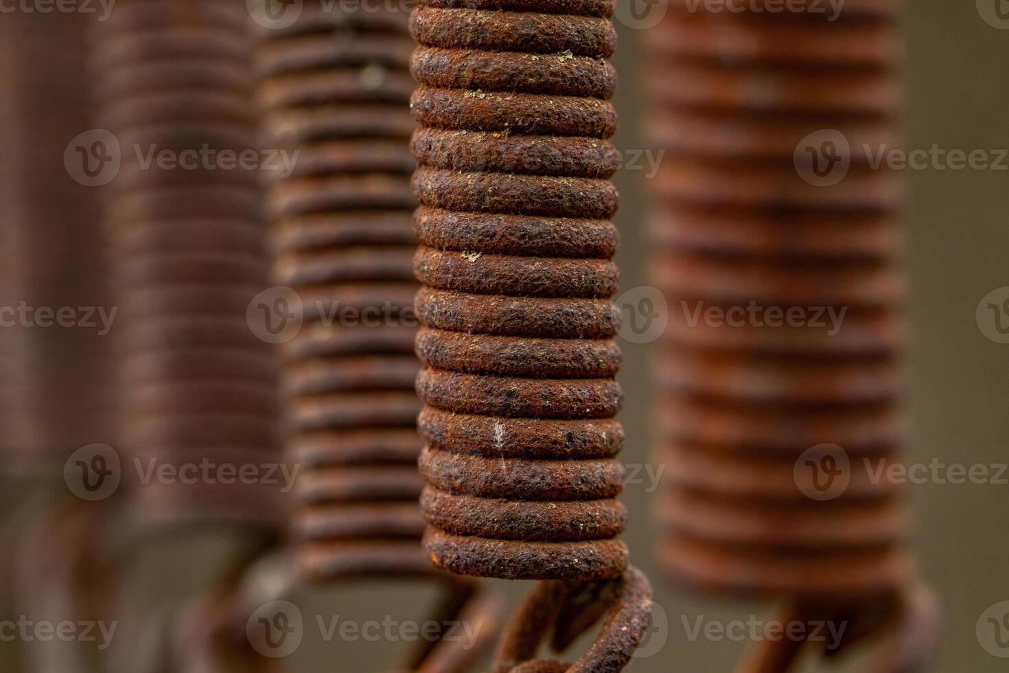 Close-up of a Rusty Metal Spring. Industrial surface. Iron photo