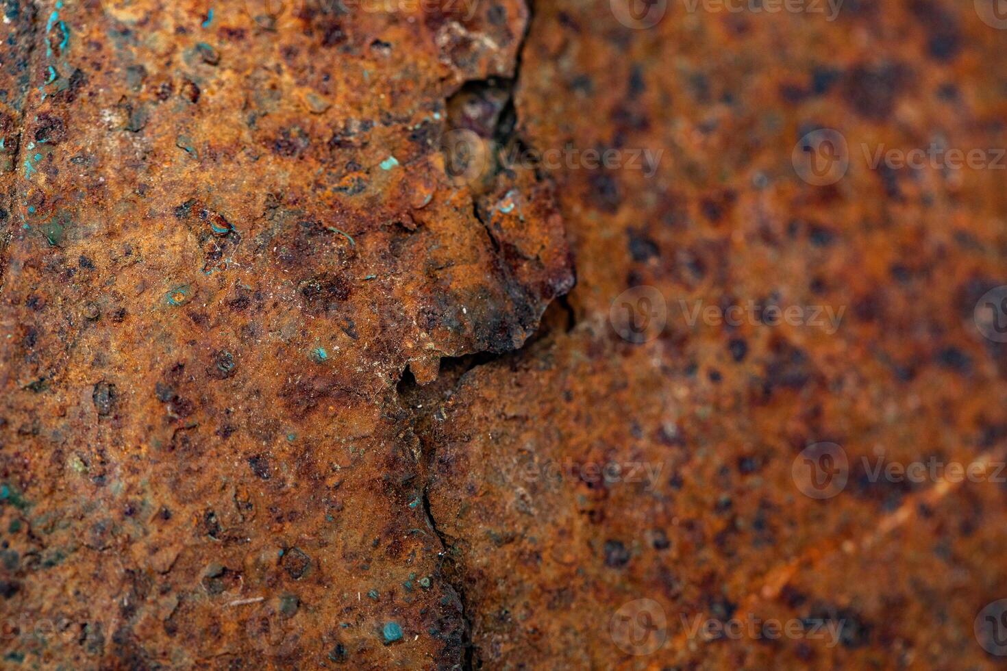 Close-up of rusted metal surface showing intricate corrosion patterns. photo