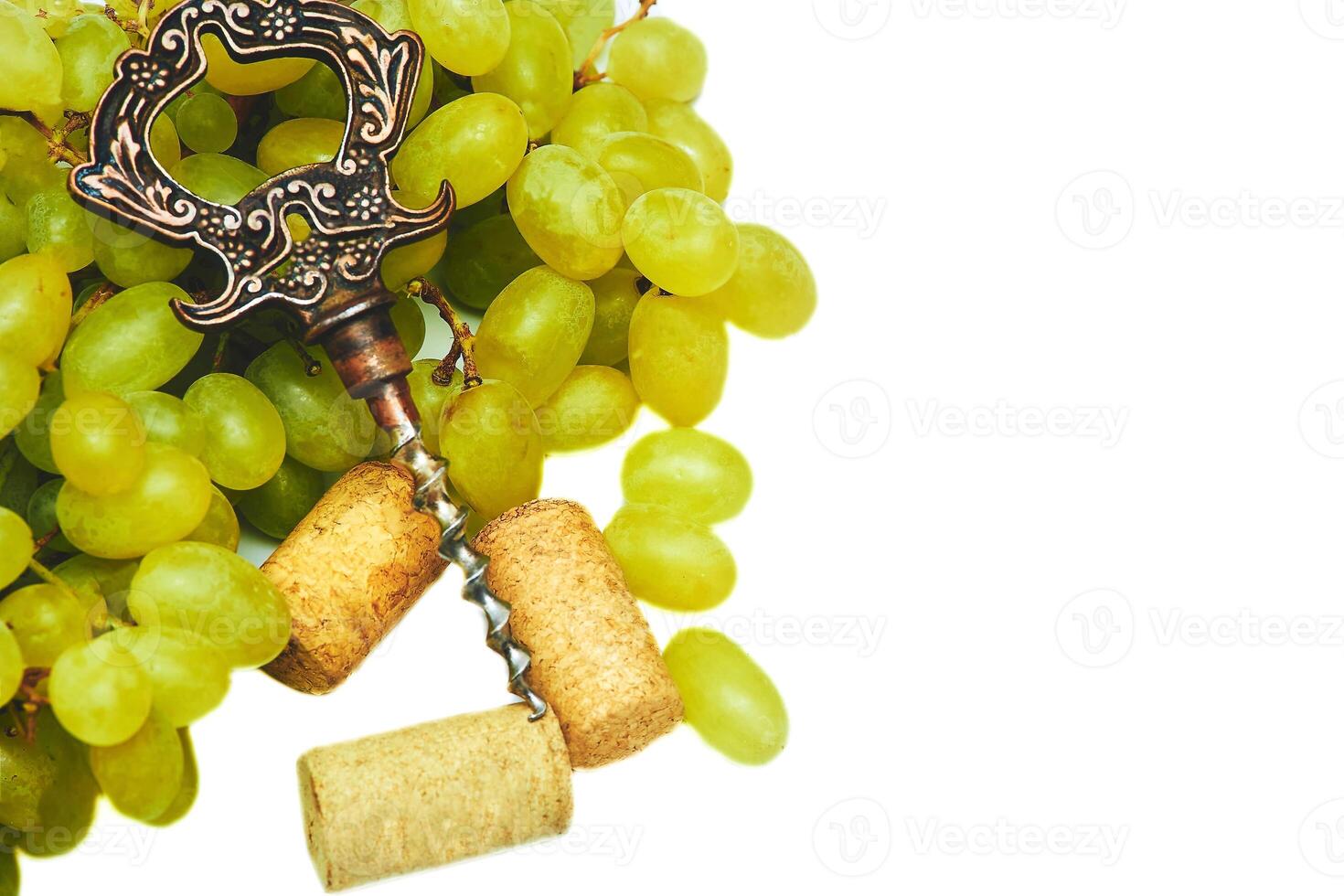 Corkscrew,wine stopper. Good old brandy, cognac, ripe grapes photo