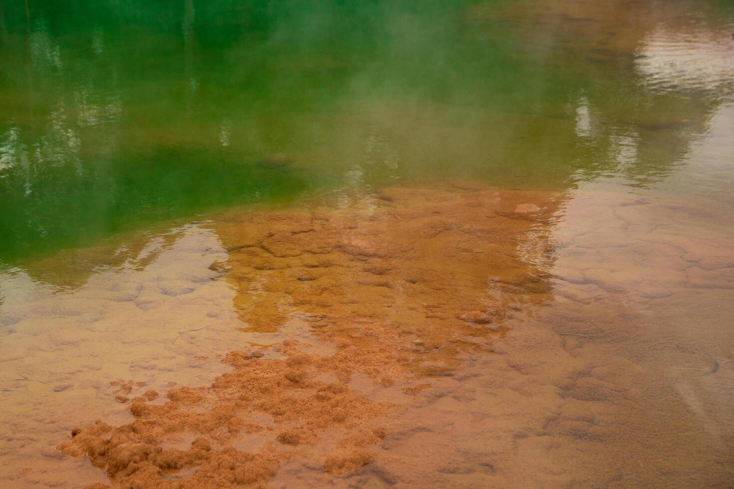 Natural thermal hot springs surrounded by peaceful nature photo