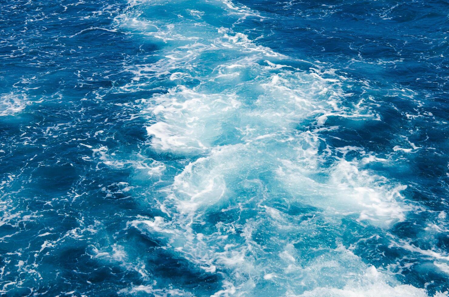 Turquoise water glistening under sunlight photo
