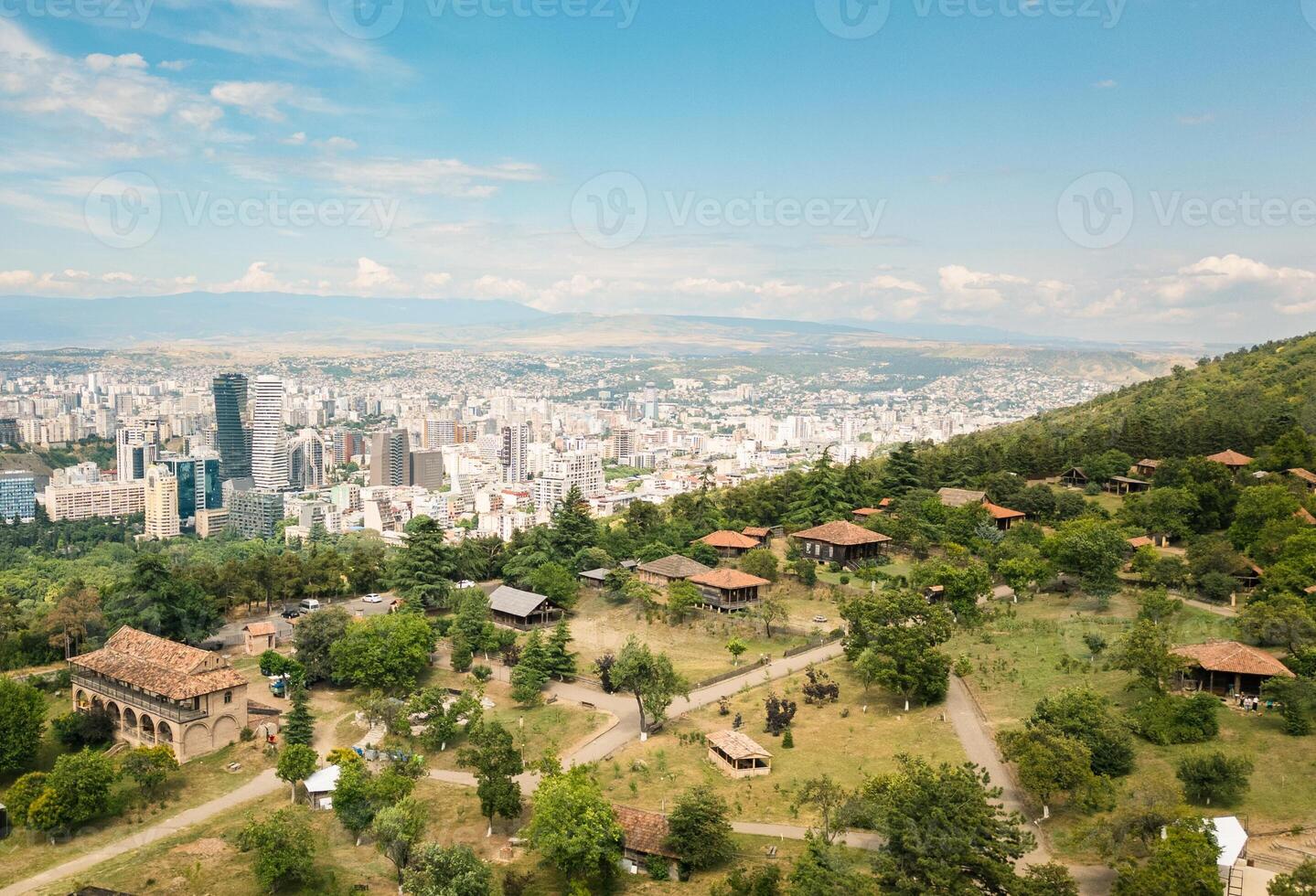 Aerial traditional georgian houses from various regions in Giorgi Chitaia Open Air Museum of Ethnography. Underrated visit destination Tbilisi city. Before after Tbilisi city historical development photo