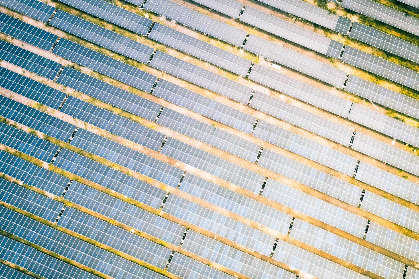 Solar energy farm.High angle, elevated view of large wide solar panels on an energy farm in rural England, full frame background texture photo
