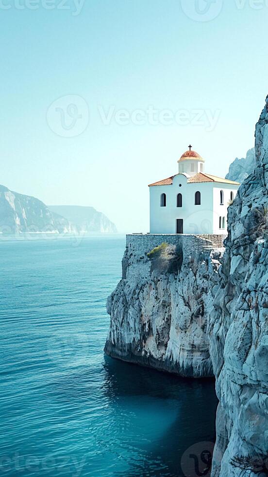 Old Stone Church on a Rocky Cliff by the Ocean. photo