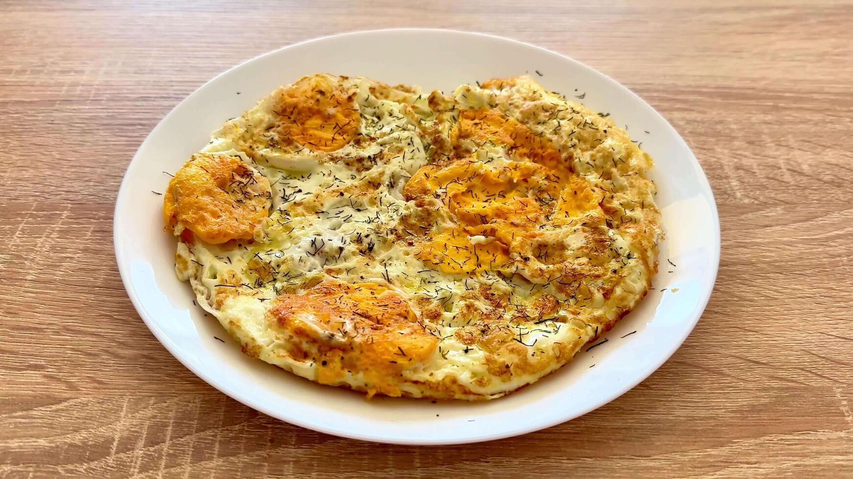 A Truly Delicious and Flavorful Egg Omelette Dish Created with Fresh and Aromatic Herbs for Eating photo