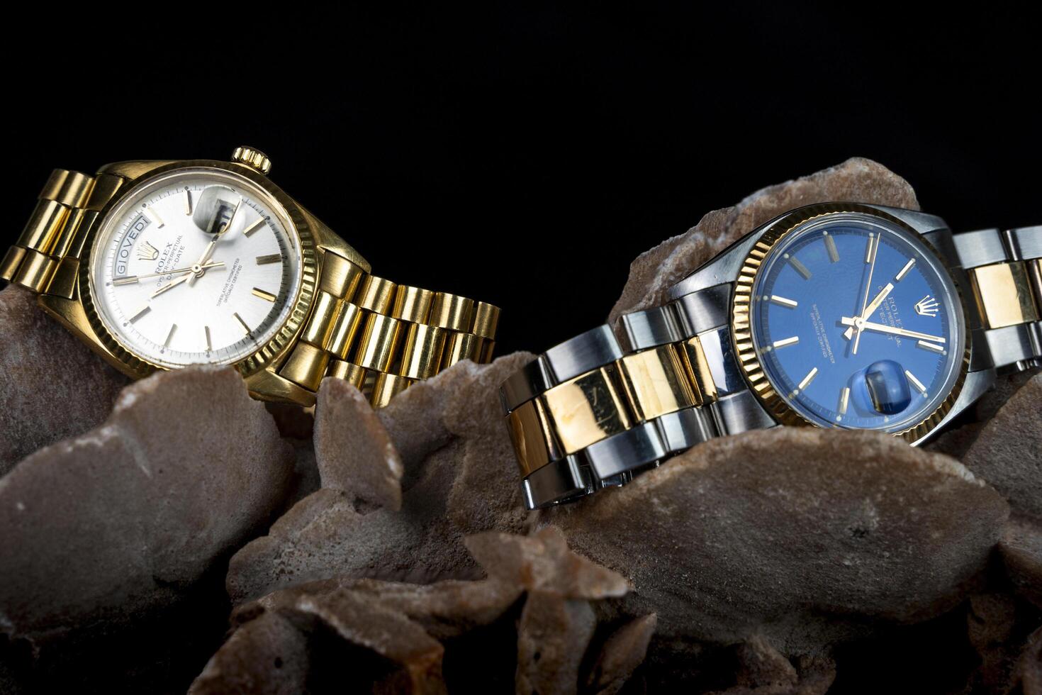 Cremona, Italy, 2019 - Rolex Oyster Perpetual Day- Date and Oyster Blue watch on a desert rose. Rolex SA is an important Swiss luxury company in the production of wrist watches photo