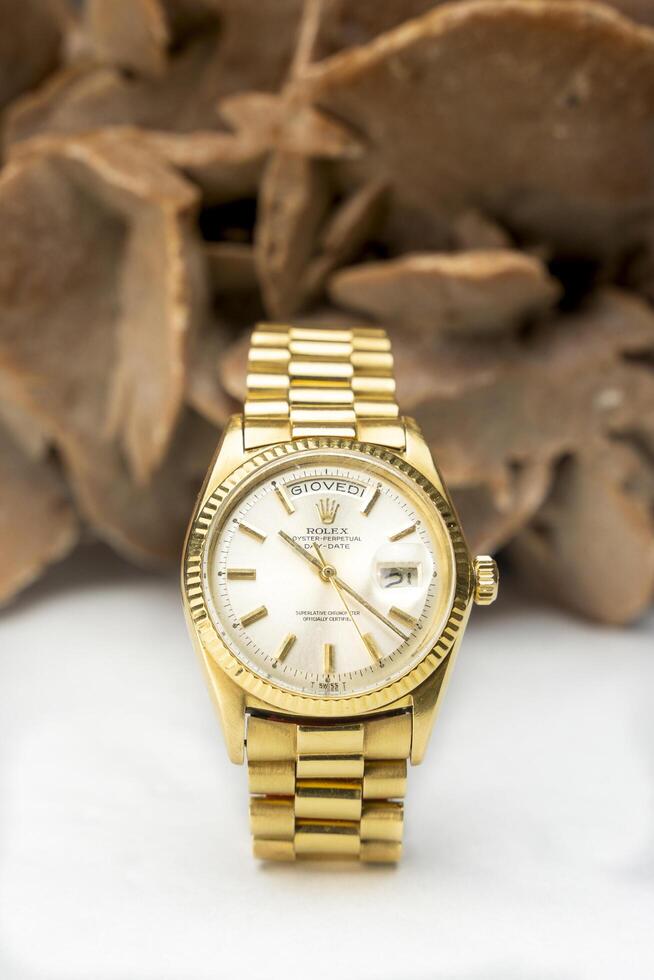 CREMONA, ITALY, 2019 - Rolex Oyster Perpetual Day- Date watch on desert rose. Rolex SA is an important Swiss luxury company in the production of wrist watches, founded in London photo