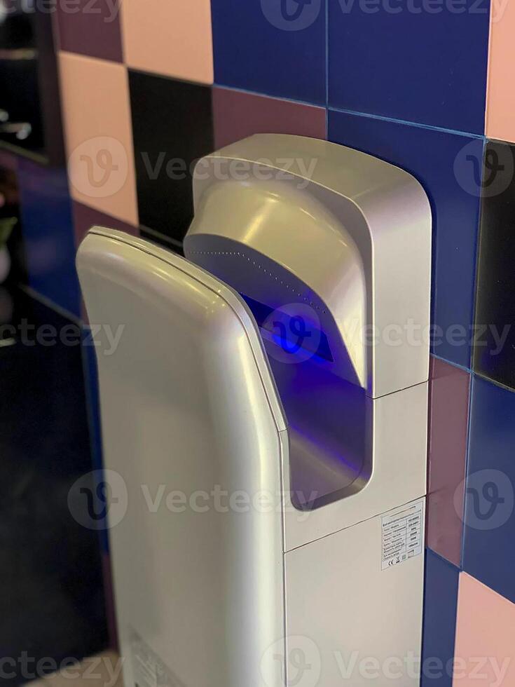 hand dryer in the toilet photo
