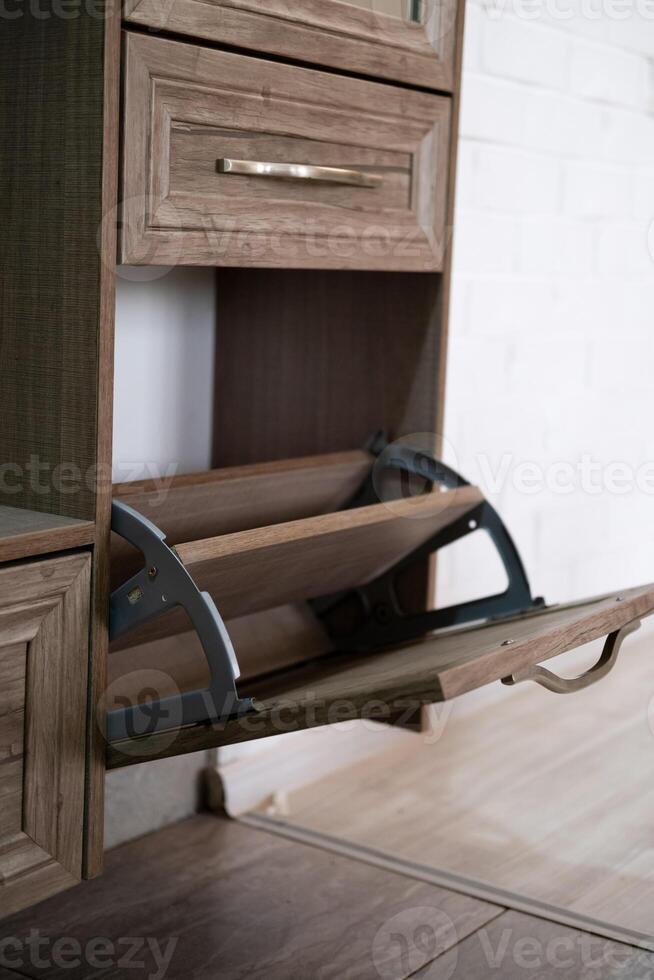 Shoe locker, with unloading shelf open photo