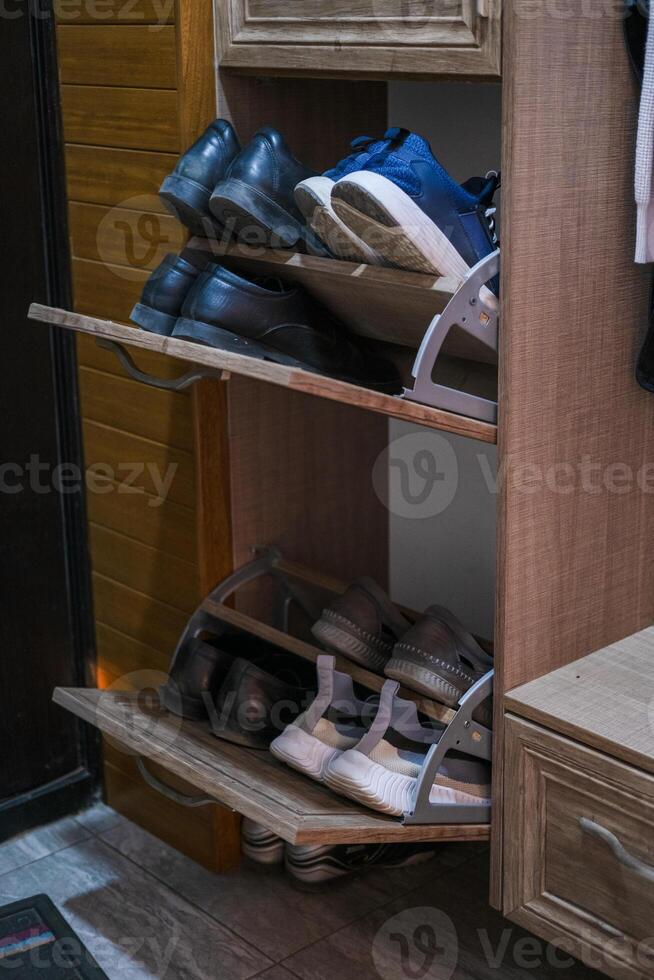 Shoe locker with unloading shelf open. photo