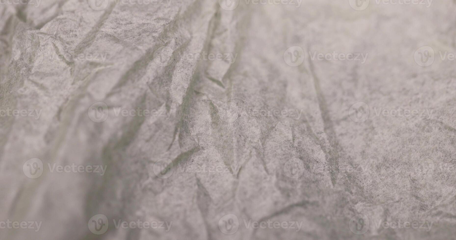 crumpled paper for packaging , a sheet of paper crumpled after use photo