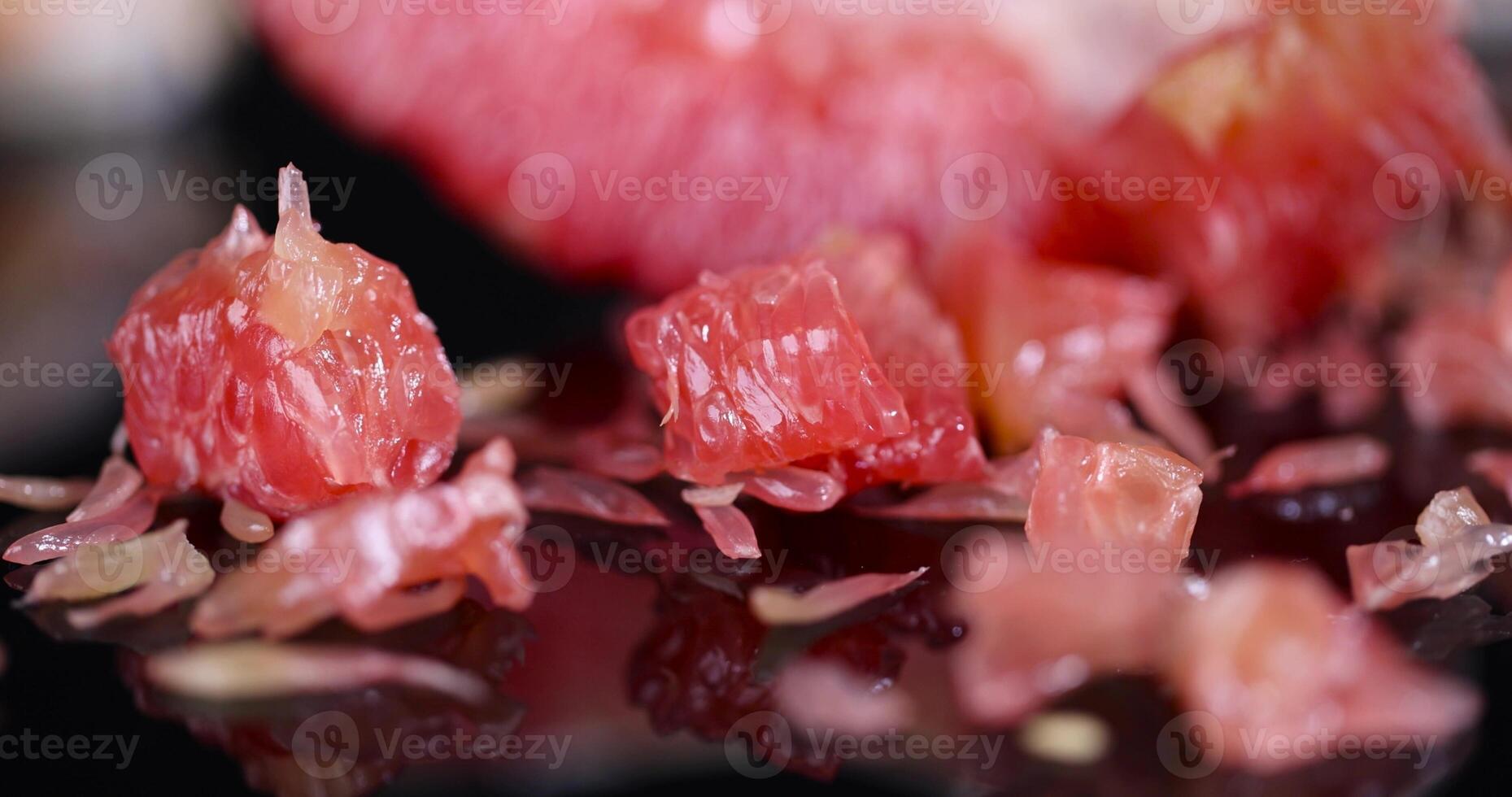 peeled citrus grapefruit with bright red and juicy flesh photo