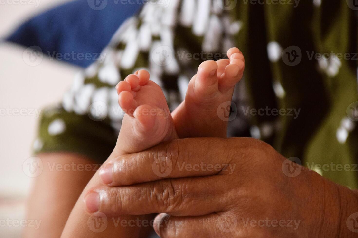 Baby care by Asian mother with gentle touch photo