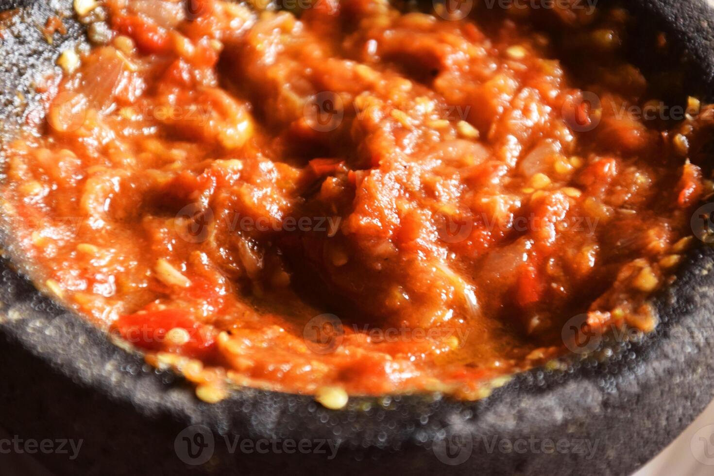 Close up of Indonesian chili tomato sambal with shrimp paste photo