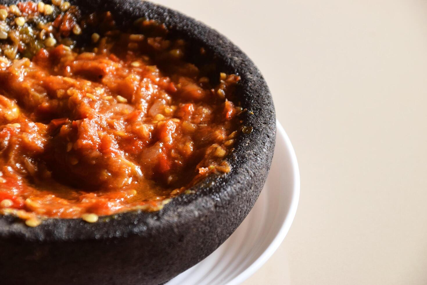 Indonesian chili tomato sambal with shrimp paste on plate photo