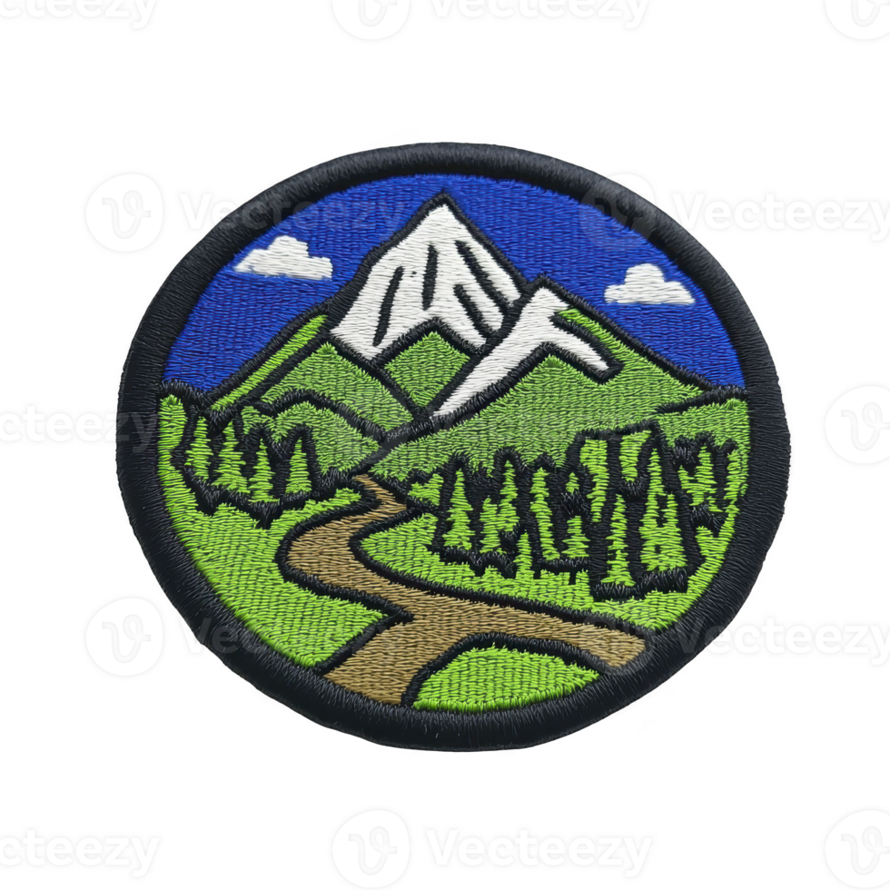Circular embroidered patch features scenic mountain landscape with snow capped peak, green hills, and winding path through forest under blue sky with clouds png