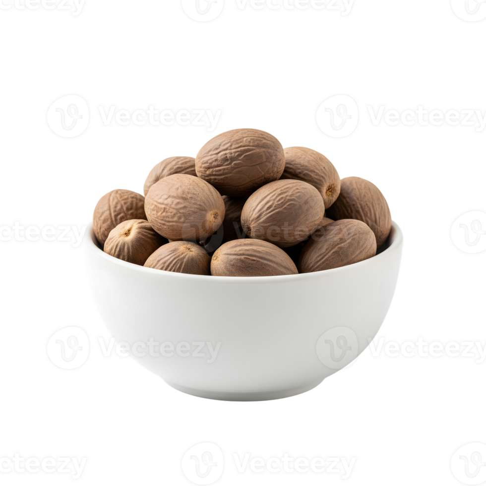 A white bowl filled with whole nutmeg seeds showcasing their textured brown shells and oval shape isolated on transparent background png