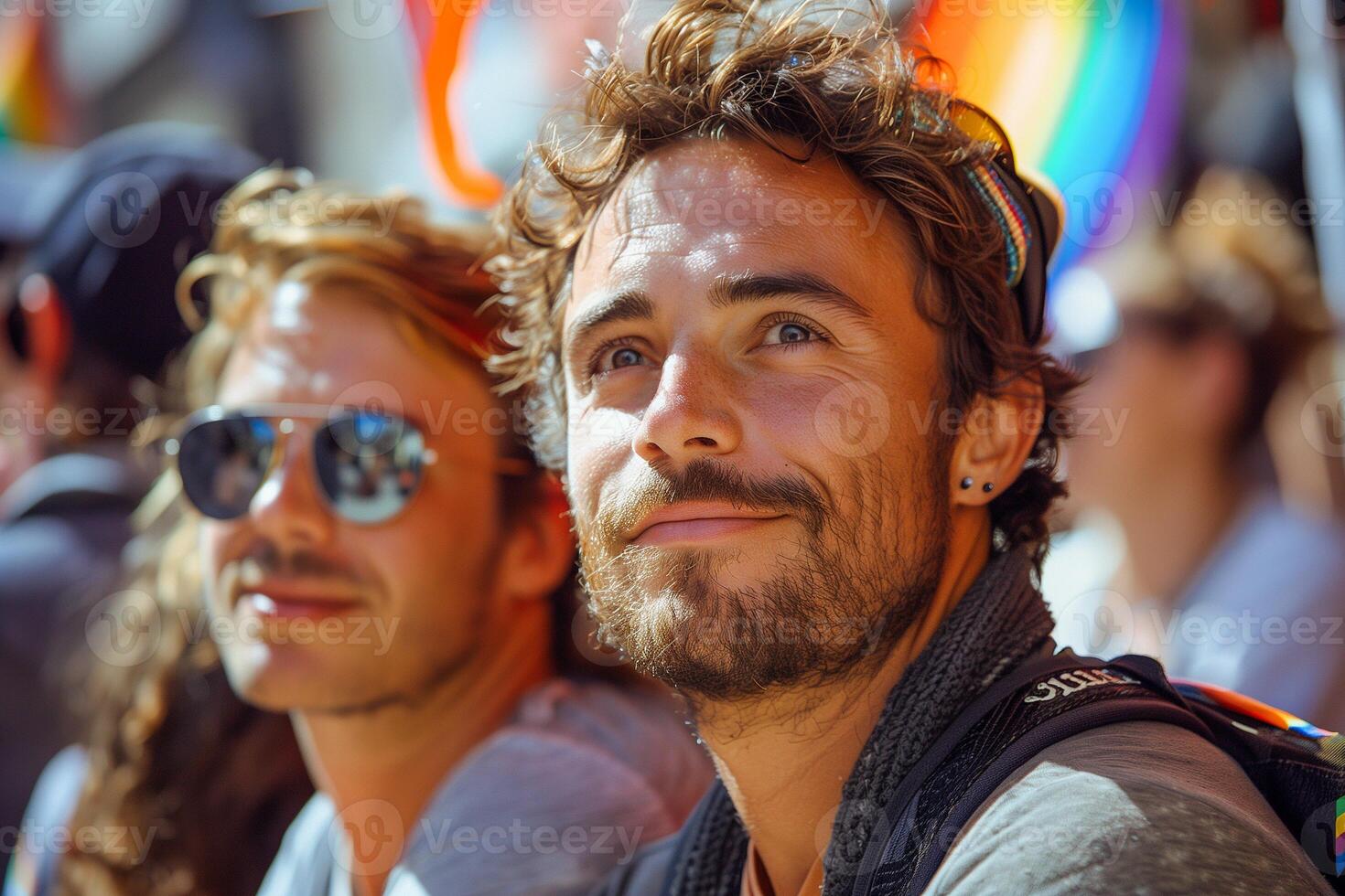 Two men are smiling and wearing sunglasses photo