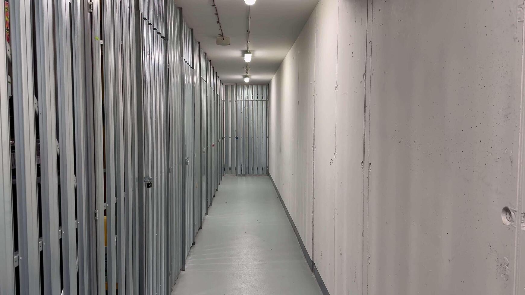 A hallway in a modern storage facility with secure, accessible units for safety and organization photo
