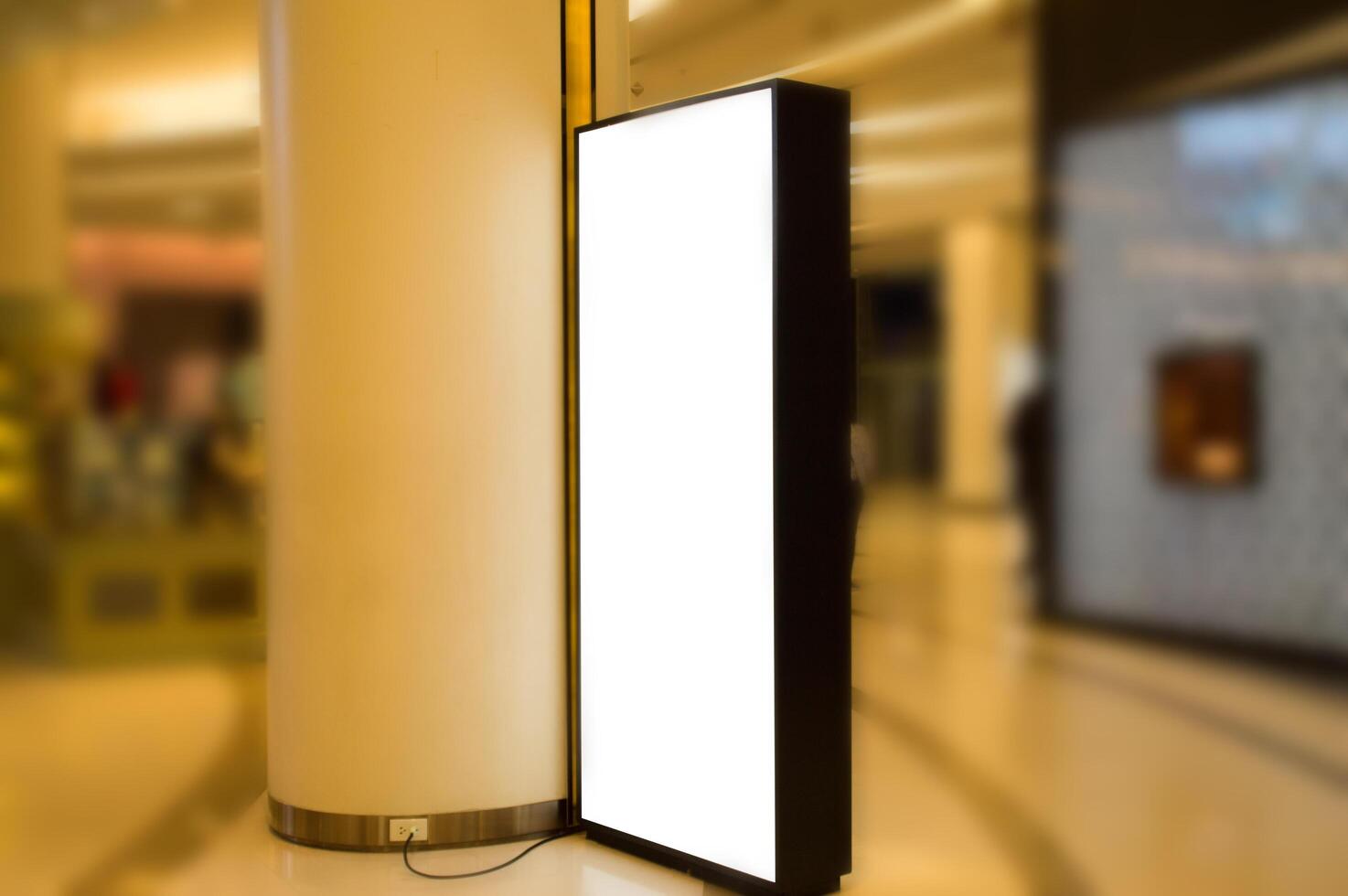 A large white billboard is sitting on the floor photo