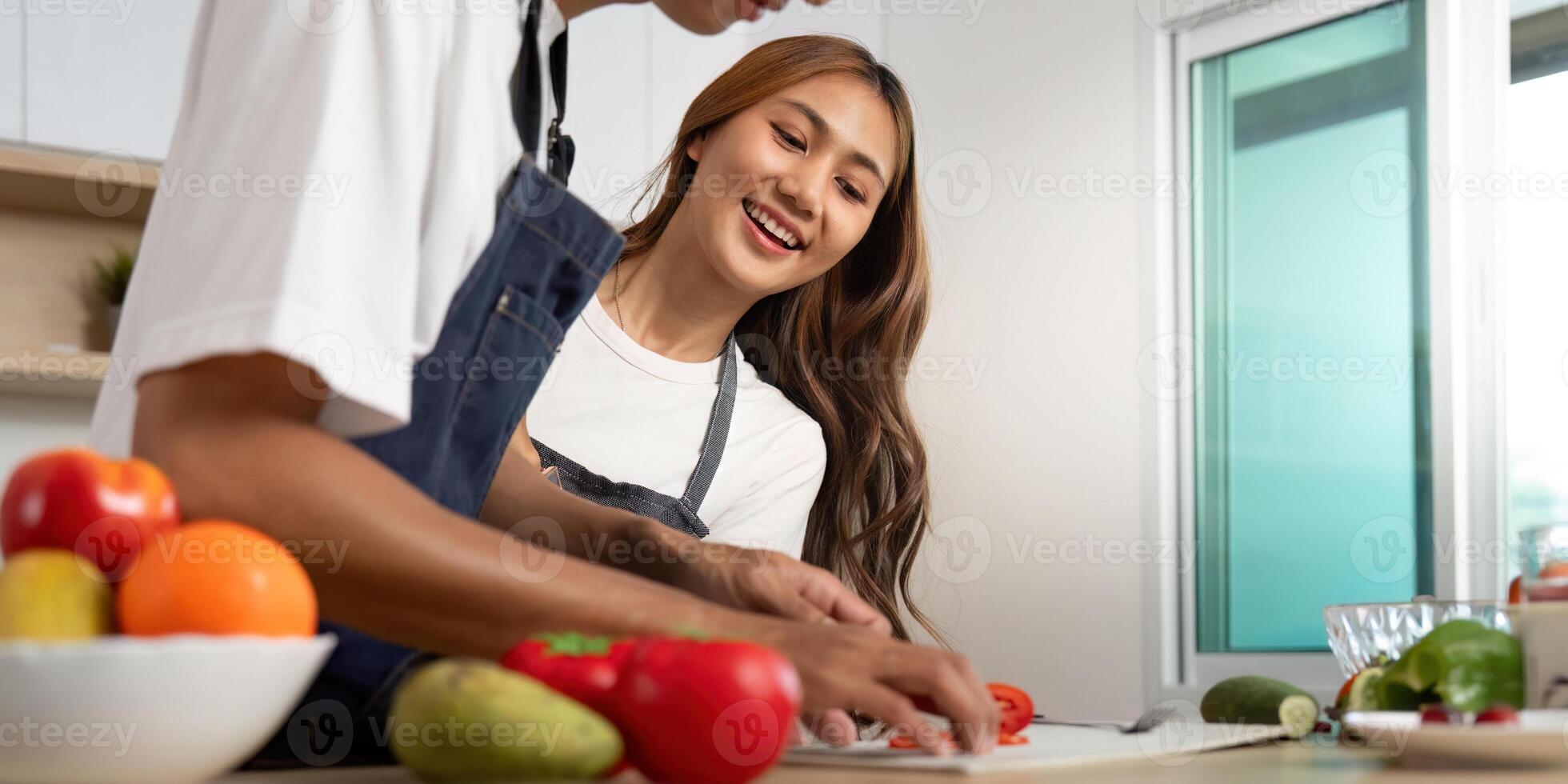 Couple Cooking Together. Preparing Fresh Ingredients in a Bright Kitchen. photo
