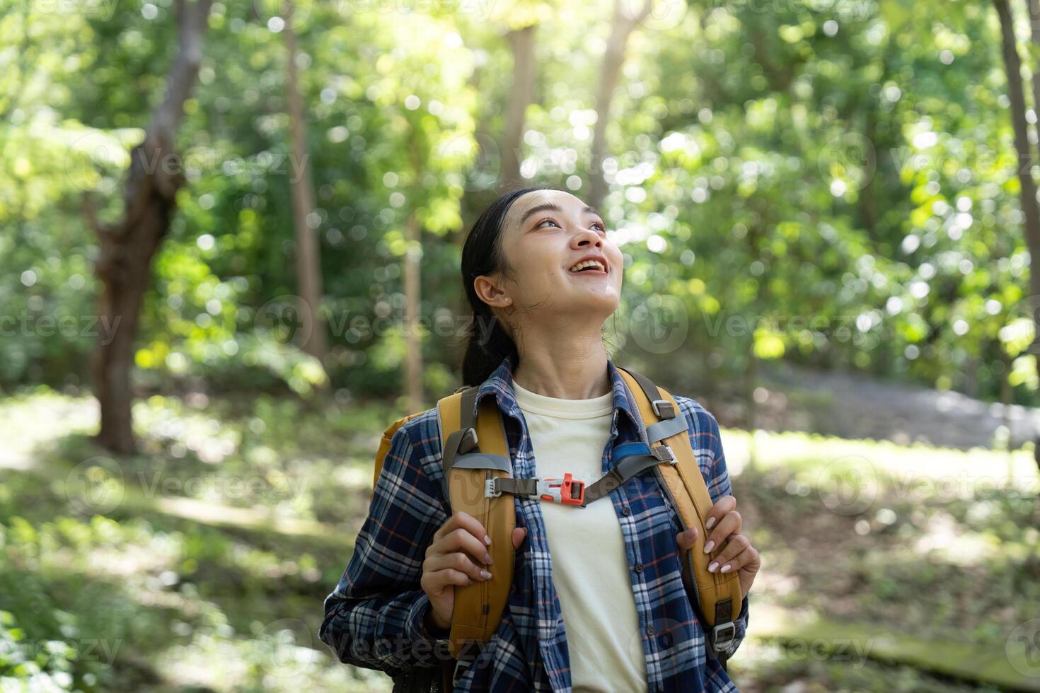 Hiker enjoying nature in forest photo