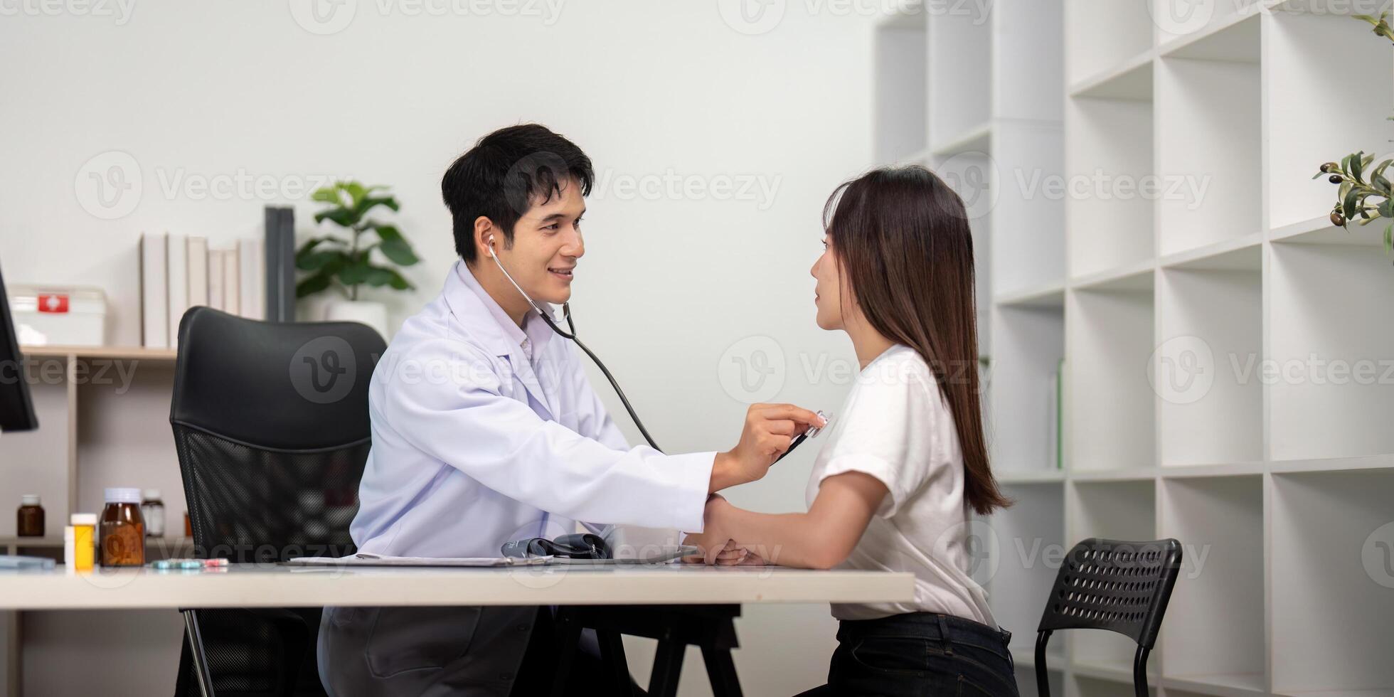 Health Checkup. Doctor using stethoscope for patient examination. photo
