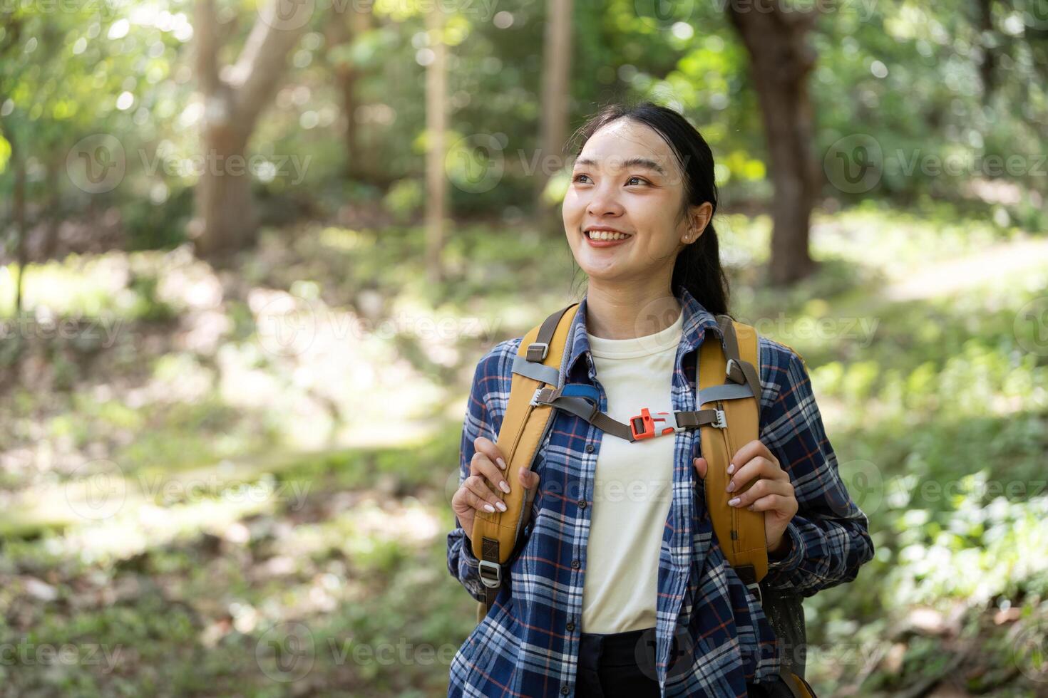 Woman hiking in a forest photo