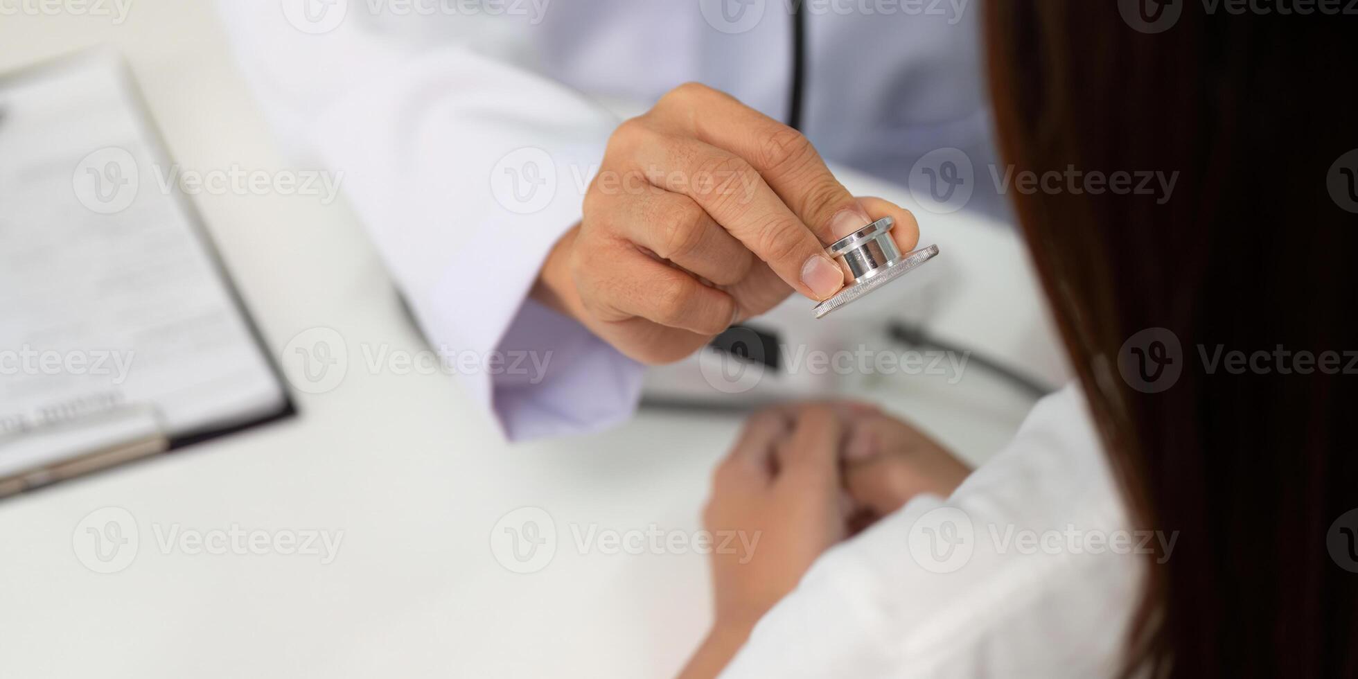 Stethoscope Examination. Doctor using stethoscope to assess patient's health. photo