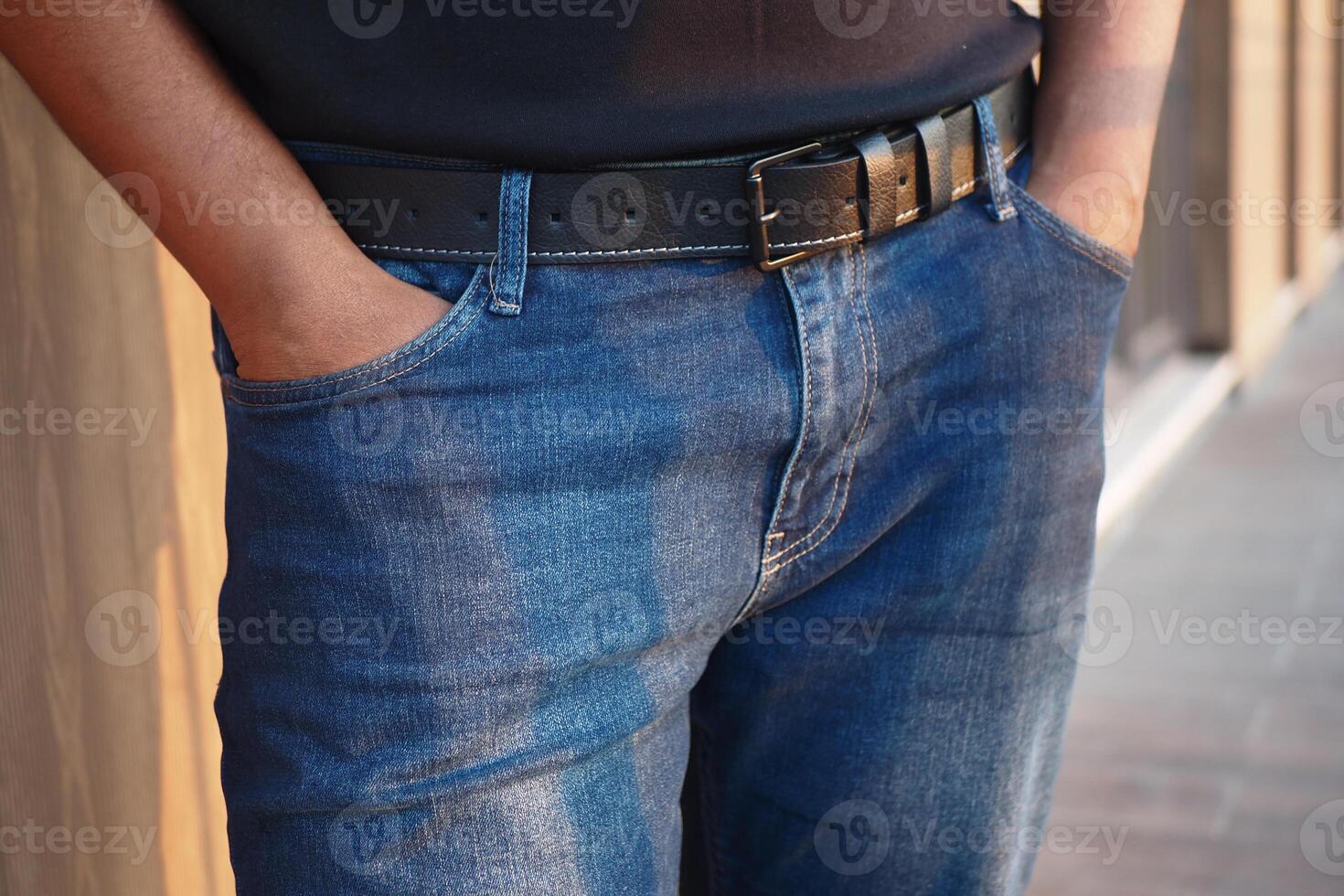Stylish casual wear in urban setting with hands in pockets photo