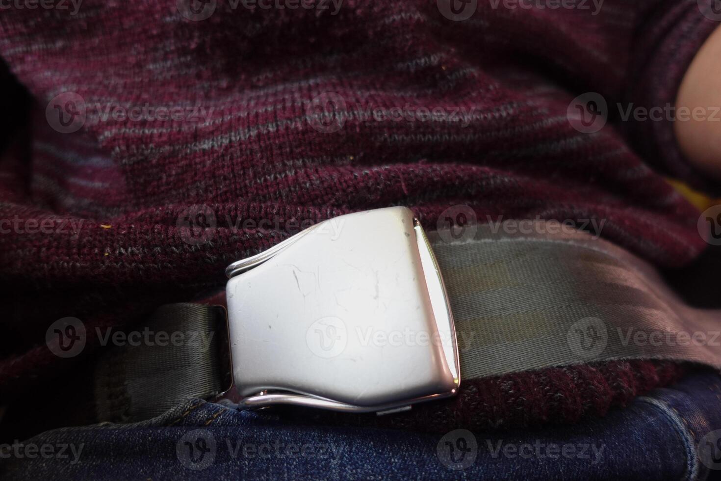 Seatbelt fastened on a passenger during a bus ride photo