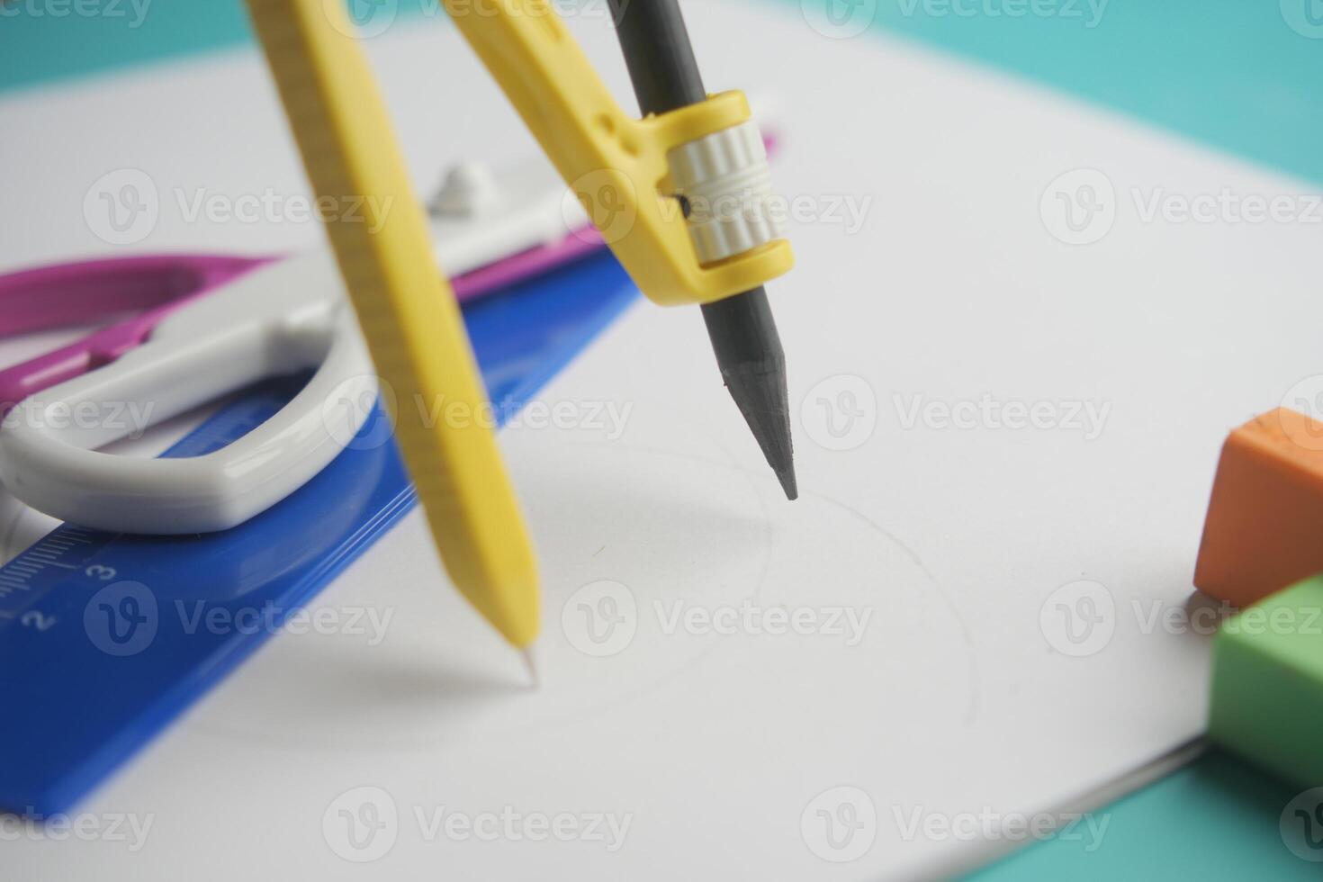 Tools are arranged for drawing and measuring on paper photo