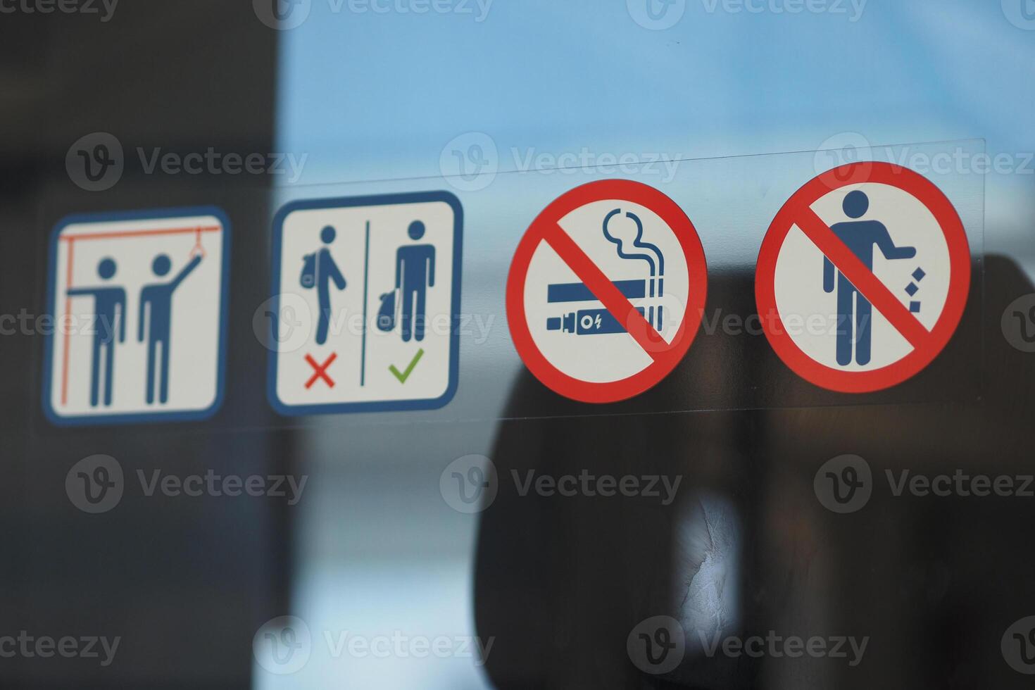 Important safety and behavior signs in a public space photo