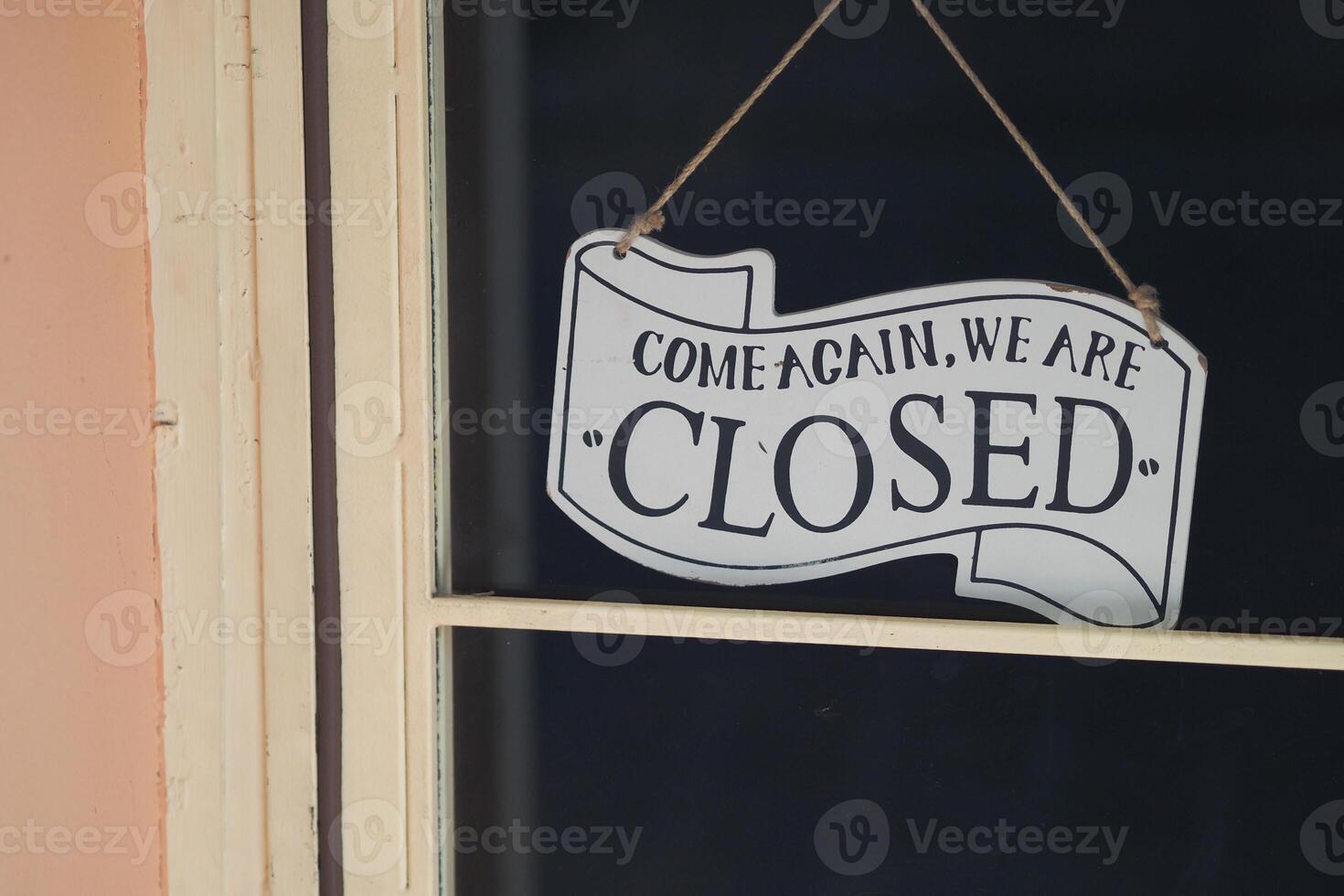 Sign indicates business is closed for the day photo