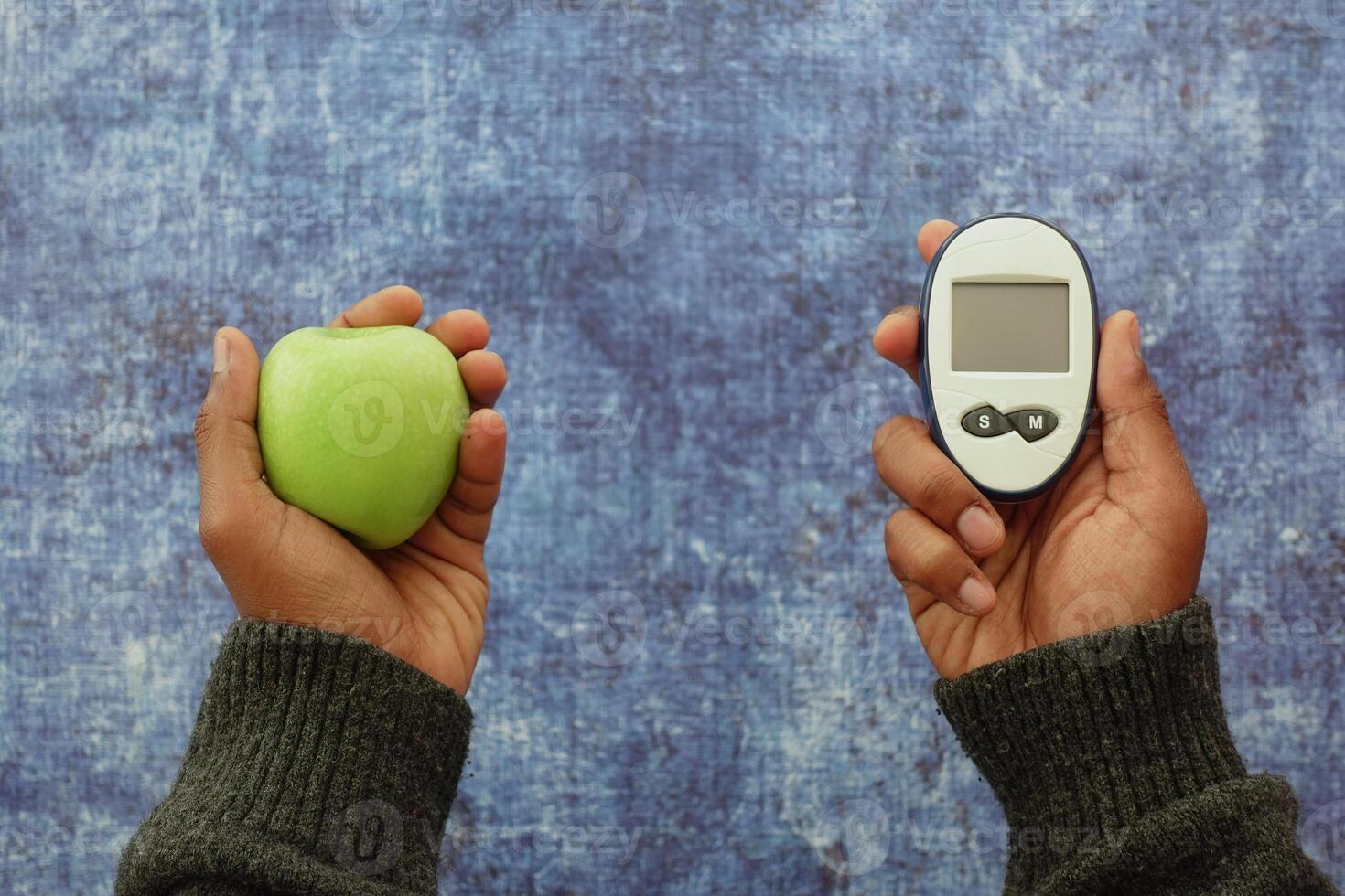 Comparing healthy food and glucose monitoring device photo