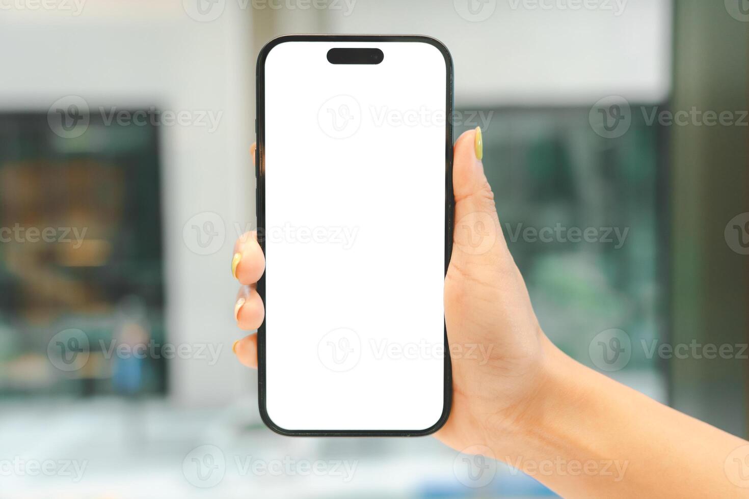White Screen Smartphone Mockup in Woman Hand. Ideal for mockups, app demonstrations, or showing digital content. Woman Shopping. Woman Content. photo