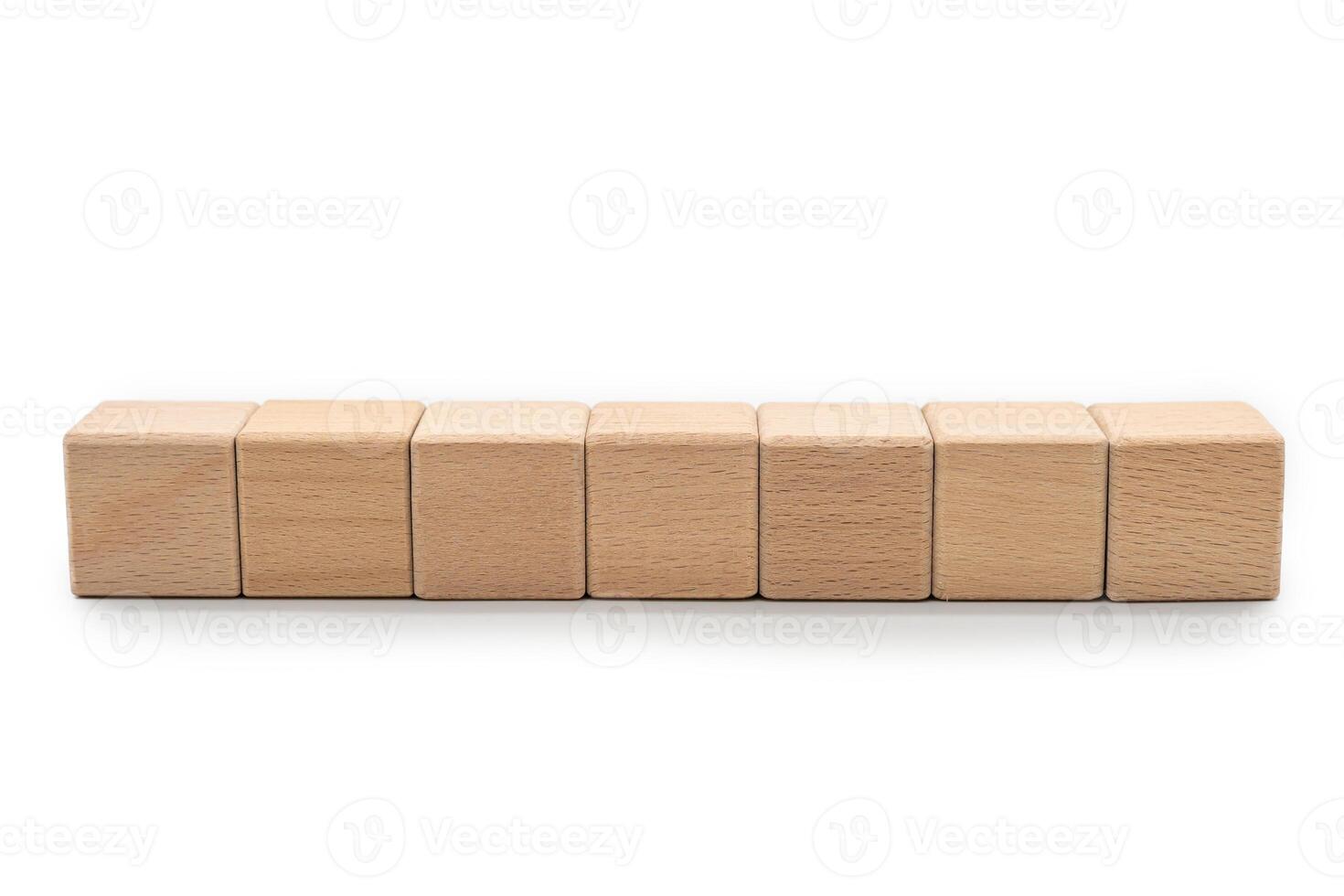 Seven Blank Wooden Blocks for Custom Text or Icons. Wood blocks arranged horizontally isolate on white background with clipping path. ideal for adding custom text, numbers or symbols. photo